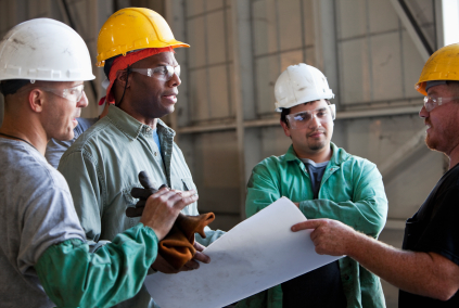 Multi-ethnic workers discussing plans.